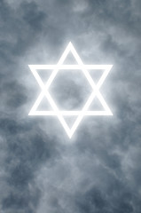 Image showing Glowing Star of David in clouds