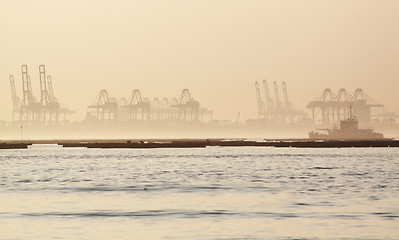 Image showing container cranes on a foggy morning