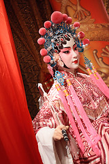 Image showing chinese opera dummy and red cloth as text space ,it is a toy,not