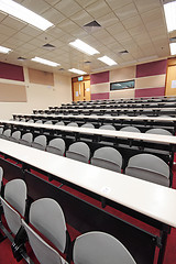 Image showing Empty hall for presentation with grey armchairs 