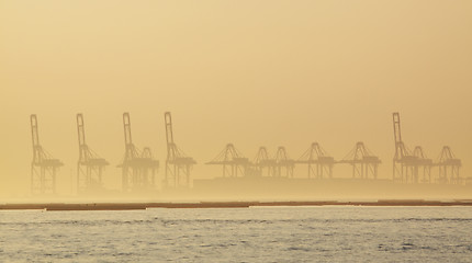 Image showing container cranes on a foggy morning