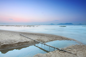 Image showing Tropical sunset on the beach.