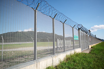 Image showing palisade on green yellow meadow 