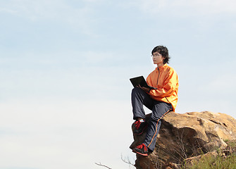 Image showing asain Man with notebook 