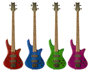 Image showing Multi-colored bass guitars 