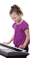 Image showing girl playing keyboard