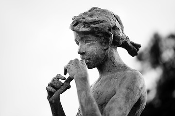 Image showing Girl playing a flute