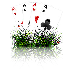 Image showing four aces behind grass reflected