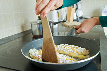 Image showing chef frying salmon steak