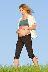 Image showing pregnant woman on meadow