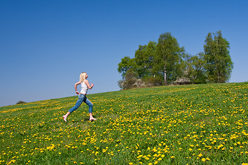 Image showing happy young woman on meadow