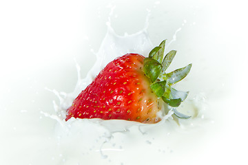 Image showing strawberry splashing into milk