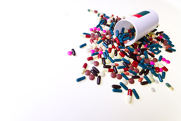 Image showing pills spilling out of container 