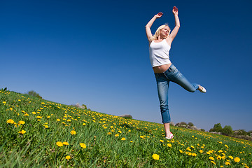 Image showing happy young woman on meadow