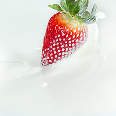 Image showing strawberry splashing into milk