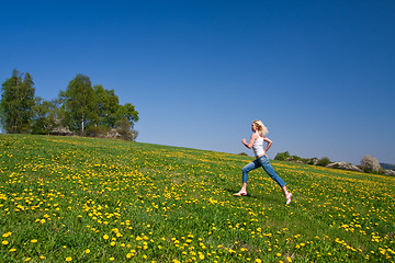 Image showing happy young woman on meadow