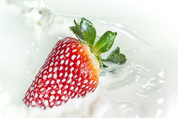 Image showing strawberry splashing into milk