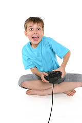 Image showing Excited boy playing a computer game