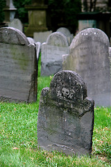 Image showing Tombstones in old grave yard one