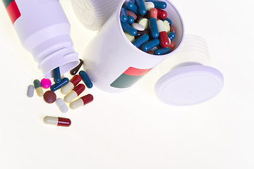 Image showing pills spilling out of container 