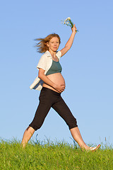 Image showing pregnant woman on meadow