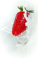 Image showing strawberry splashing into milk