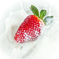 Image showing strawberry splashing into milk