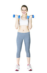 Image showing Happy active girl holding weights