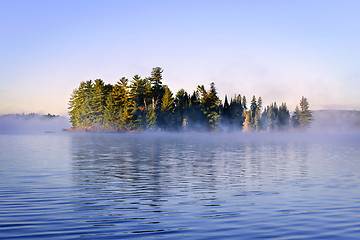 Image showing Island in lake with morning fog