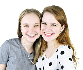 Image showing Two teenage girls listening to music