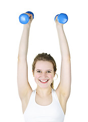 Image showing Fit active girl lifting weights for fitness