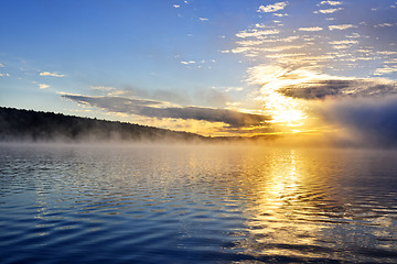 Image showing Sunrise on foggy lake