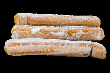 Image showing Frozen hotdogs in a bunch