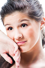 Image showing portrait of beautiful upset teenager girl on isolated white