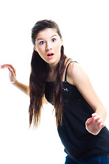 Image showing surprised  teenager girl with long dark hair on isolated white