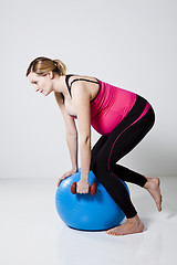 Image showing Pregnant woman exercising with dumbbells