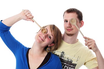 Image showing Couple with two wooden spoons