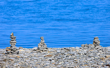 Image showing pyramids of stones on the beach