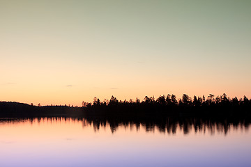 Image showing sunset over lake in forest