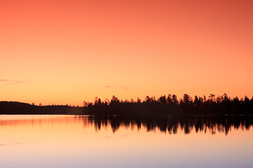 Image showing sunset over lake in forest