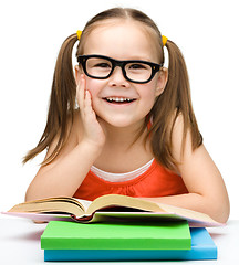 Image showing Cute little girl with books