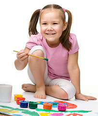 Image showing Cute cheerful child play with paints