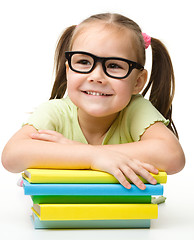 Image showing Cute little girl with books