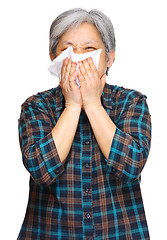 Image showing sneezing mature asian woman