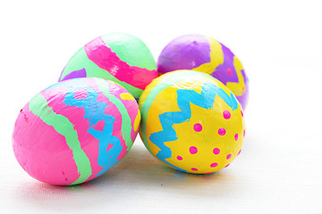 Image showing children paint colorful easter egg