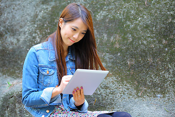 Image showing beautiful asian woman using tablet computer