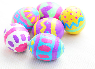 Image showing children paint colorful easter eggs