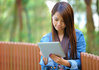 Image showing young asian woman with tablet computer