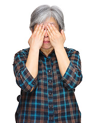 Image showing middleage asian woman cover eyes