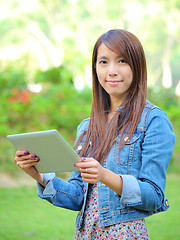 Image showing young asian woman with tablet computer